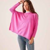 Sugar pink oversized cashmere knit sweater with relaxed fit and long sleeves.