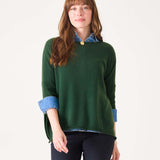 Women's travel-friendly hunter green cashmere knit sweater with a layered denim shirt collar and cuffs.