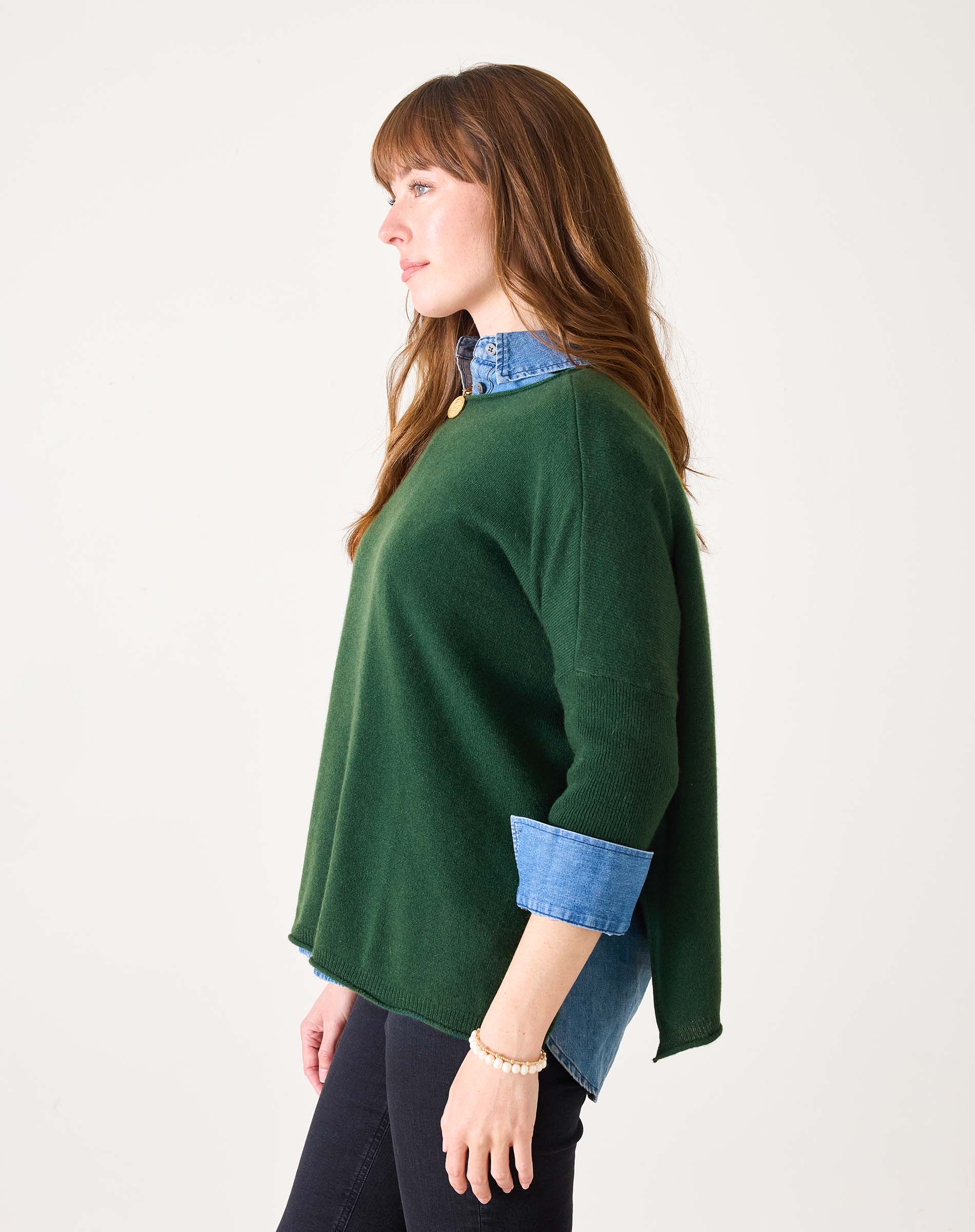 Hunter green cashmere sweater with a layered denim shirt collar and cuffs.