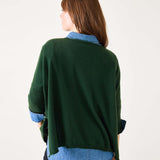 Back view of woman's travel-friendly hunter green cashmere sweater.