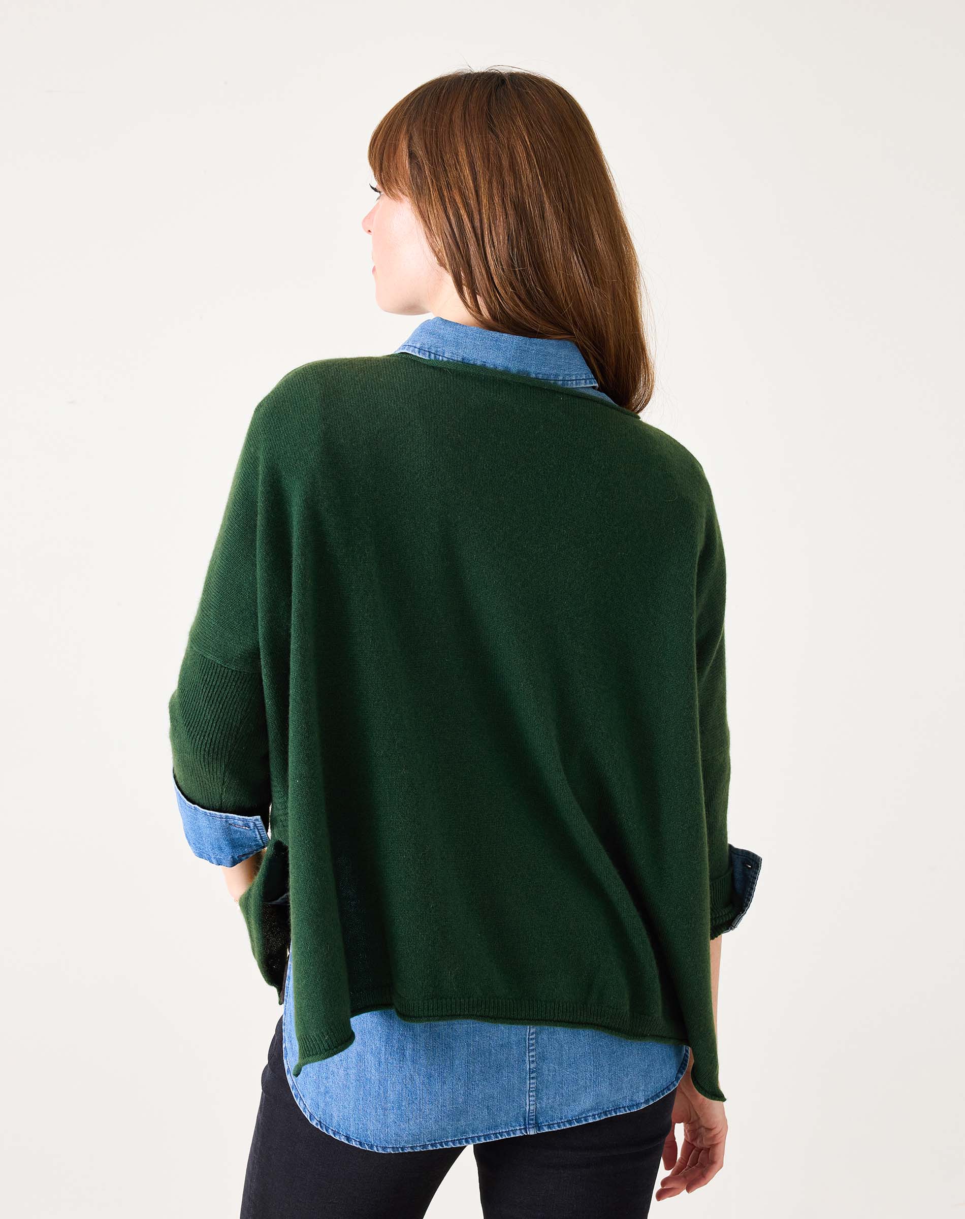 Back view of woman's travel-friendly hunter green cashmere sweater.