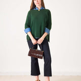 Hunter green cashmere knit sweater with a round neckline and dropped shoulders.