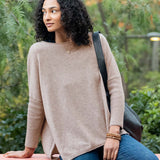 Toast colored oversized knit cashmere sweater with dropped shoulders and a relaxed fit.