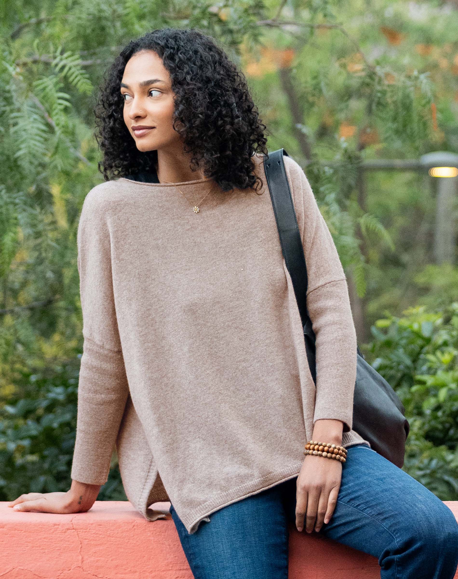 Toast colored oversized knit cashmere sweater with dropped shoulders and a relaxed fit.