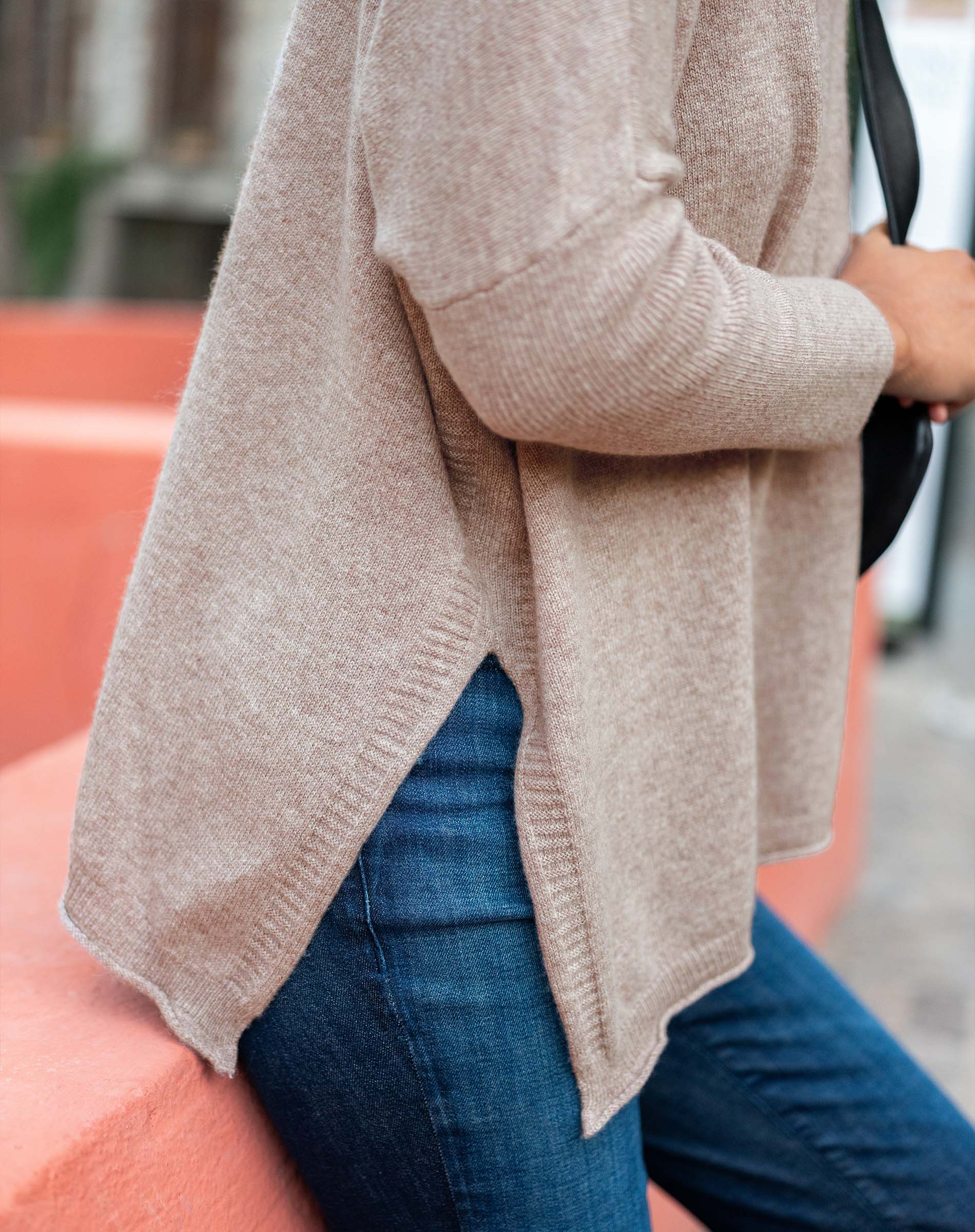 Toast colored cashmere sweater with a soft knit weave and side slit detail