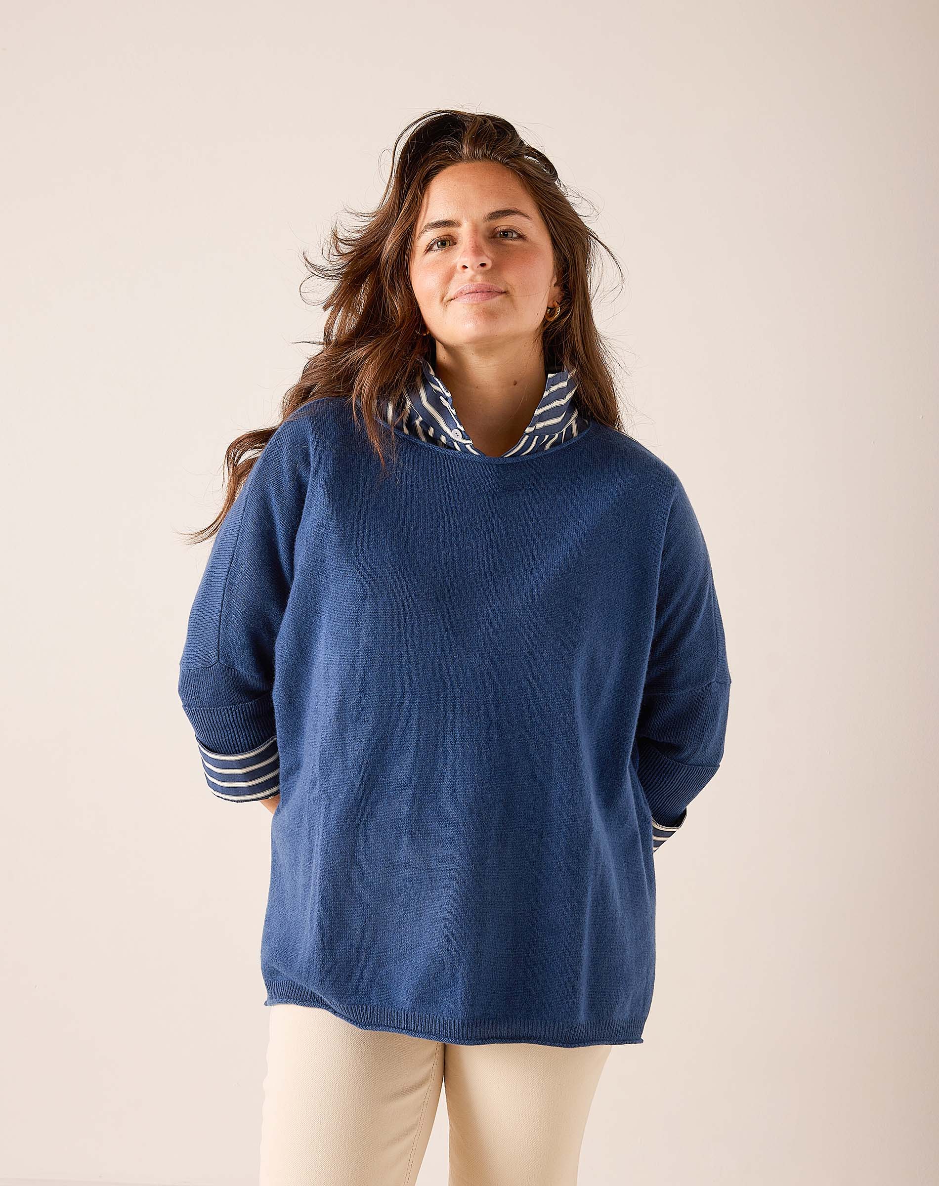 Ladies' travel-ready yale blue relaxed-fit cashmere sweater featuring a striped mock neck and striped cuff details.