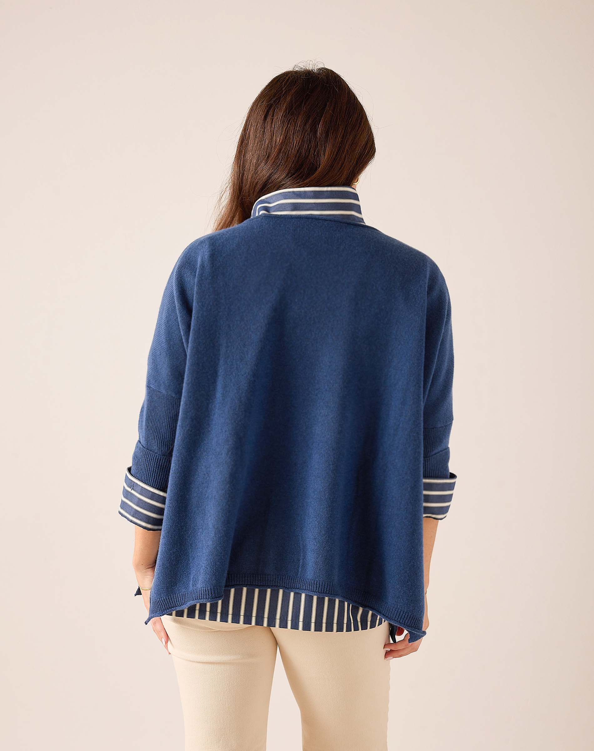 Back view of women's travel-friendly Yale Blue cashmere sweater with striped detailing on the collar and cuffs.
