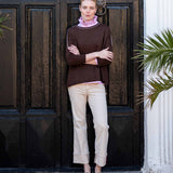 MERSEA women's travel-friendly women's travel-friendly coffee brown knit top with a contrasting cream-colored collar and hem.