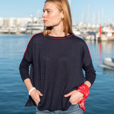 MERSEA women's travel-friendly navy knit top with red contrast trim on sleeves and neckline.
