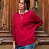 MERSEA ladies' travel-ready pinkberry crewneck knit top with a high neckline and long sleeves.