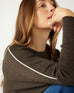 closeup of shoulder woman wearing mersea catalina contrast sweater in cocoa with white trim