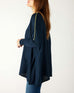 profile of woman wearing mersea catalina contrast sweater in navy with chartuese trim
