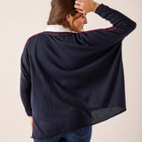 Navy and red oversized knit sweater with a relaxed fit and contrast trim detailing