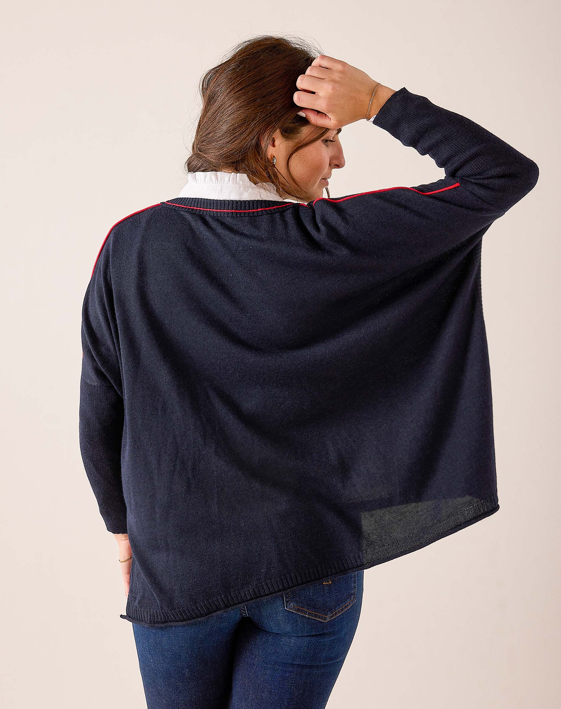 Navy and red oversized knit sweater with a relaxed fit and contrast trim detailing