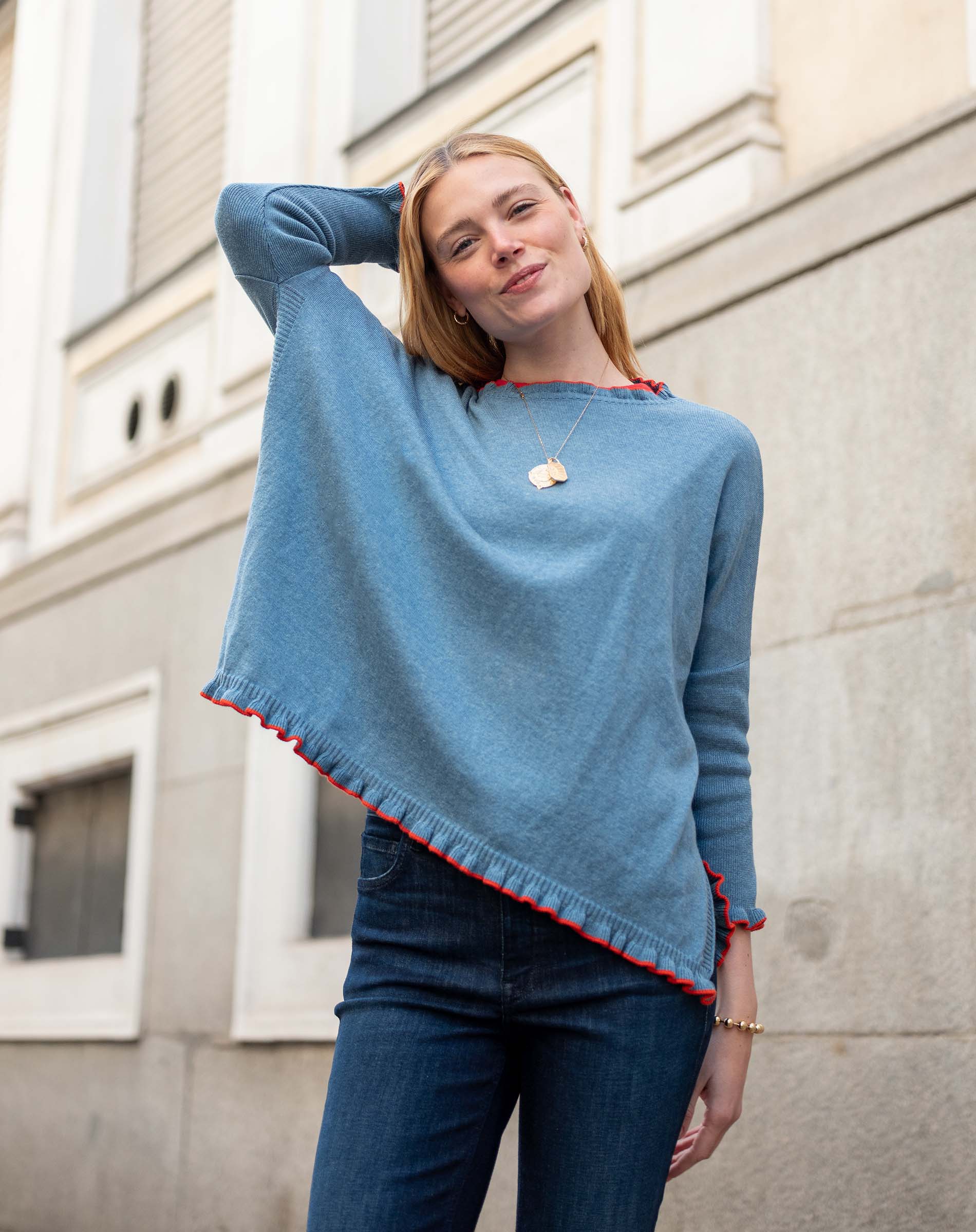 Aegan blue cotton ruffle sweater with vermillion trim.