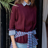 Burgundy and sapphire striped knit wrap and long-sleeve sweater with ruffle details.