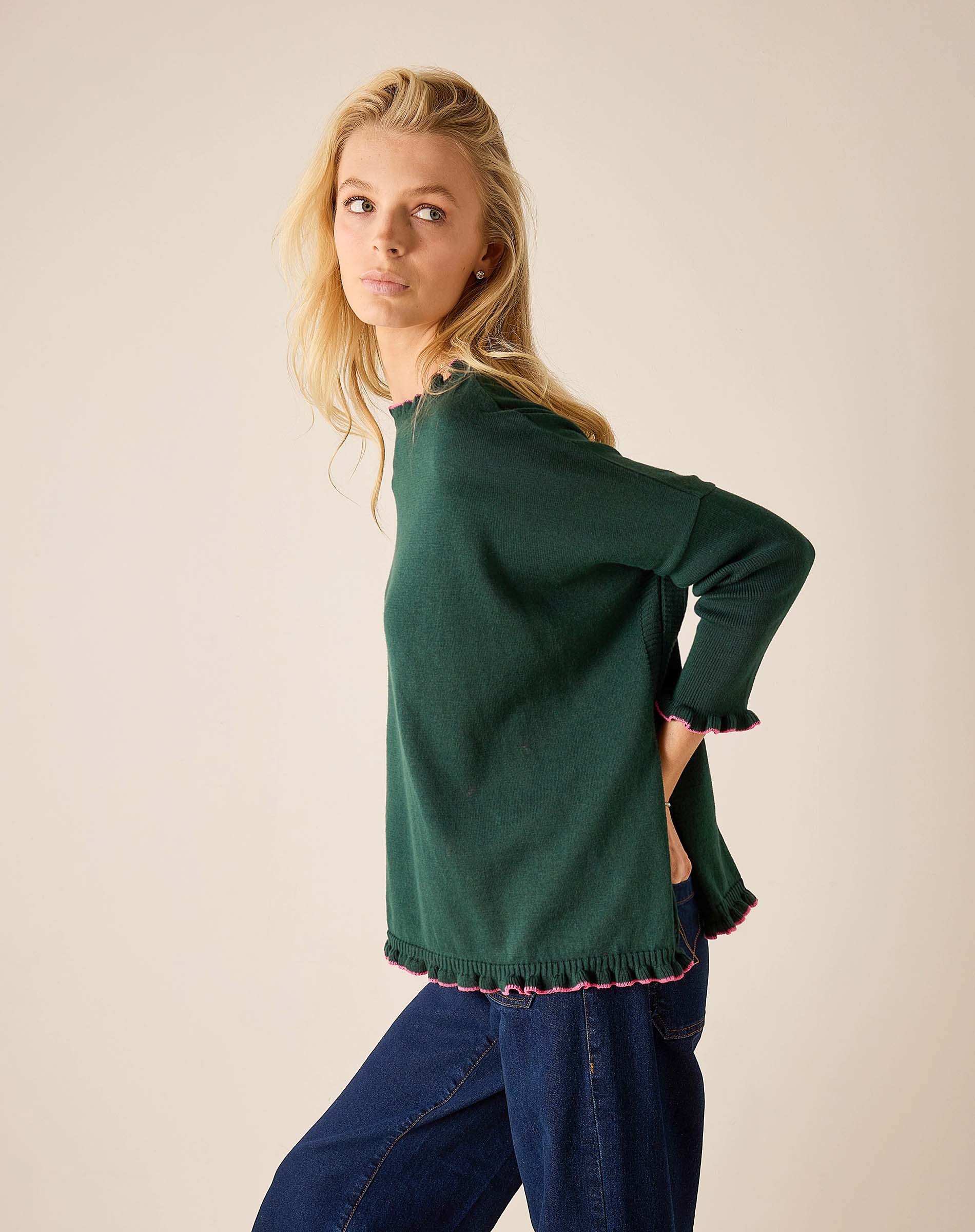 Forest green cotton knit sweater with ruffled trim and bubblegum pink accents.