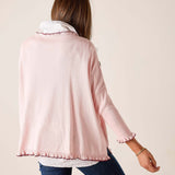 Back view of the light orchid ruffled cotton sweater.