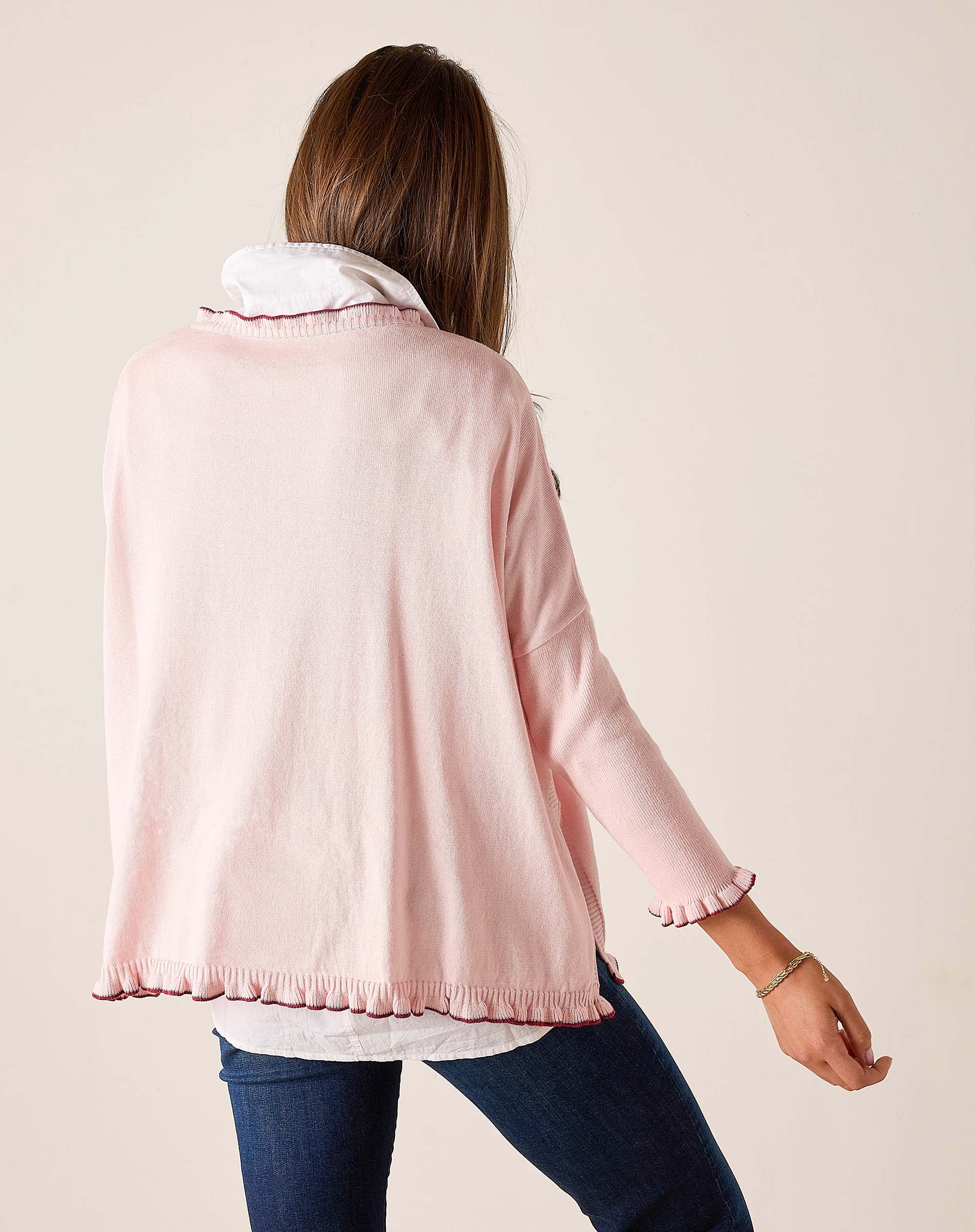 Back view of the light orchid ruffled cotton sweater.
