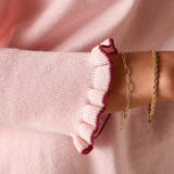 Light orchid knit sweater with bordeaux ruffled cuff detail