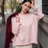 Light orchid cotton ruffle sweater with ruffled cuffs and a deep bordeaux layer.
