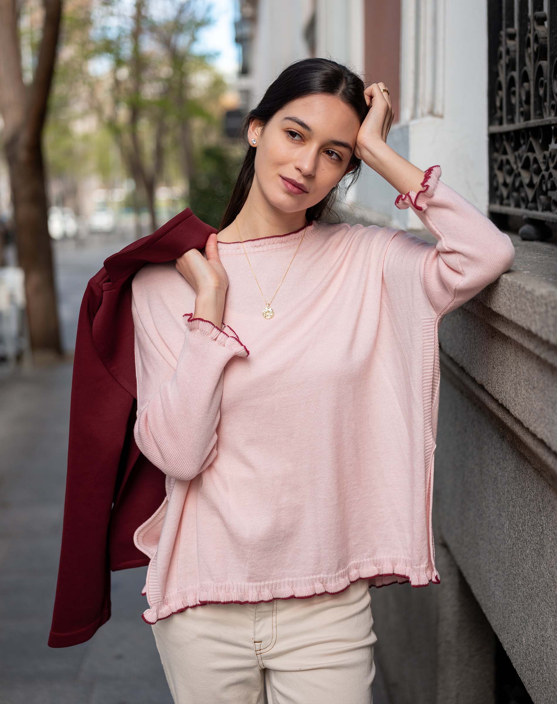 Light orchid cotton ruffle sweater with ruffled cuffs and a deep bordeaux layer.