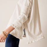 Warm white ruffled cotton knit sweater with 3/4 sleeves and a wide hem.