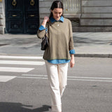 Olive green crewneck knit top with a subtle stripe and long sleeves.