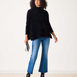 Black oversized chenille sweater with a high neck.