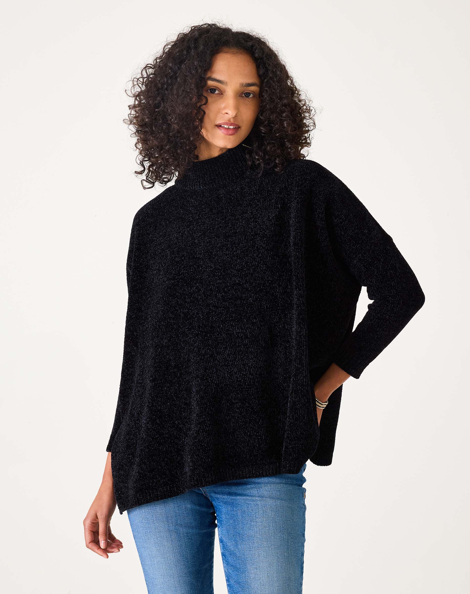 Black chenille knit sweater featuring a cozy chunky texture and wide sleeves.