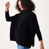 Black chenille knit sweater with a cozy oversized fit and high neckline.