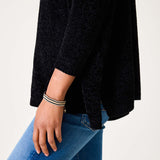 Black chenille sweater with a relaxed fit and textured weave.