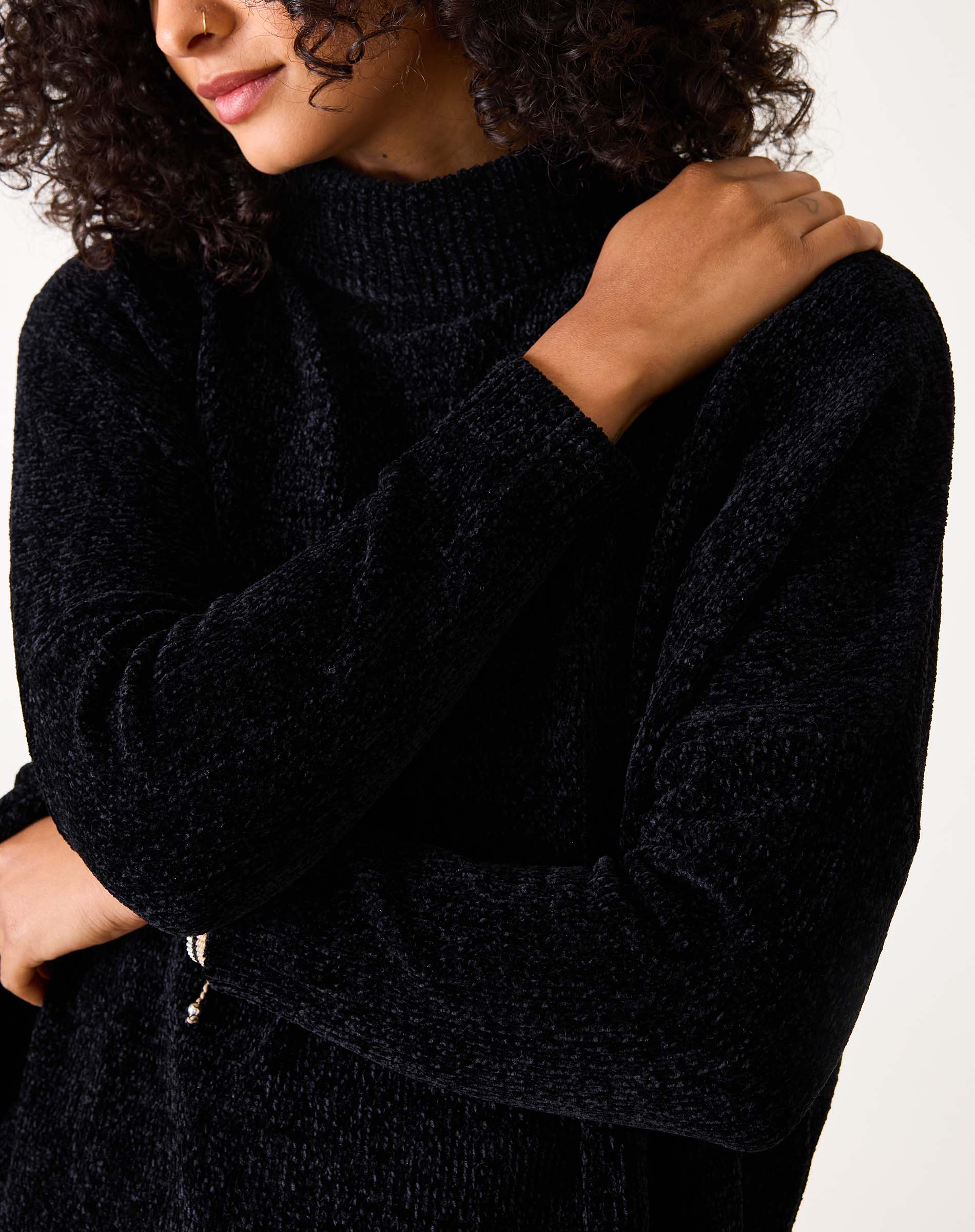 Black chenille knit sweater with a chunky high neck.