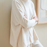 Cream chenille sweater with high neck and relaxed fit
