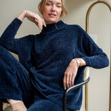Navy chenille sweater with a high neckline and relaxed fit.