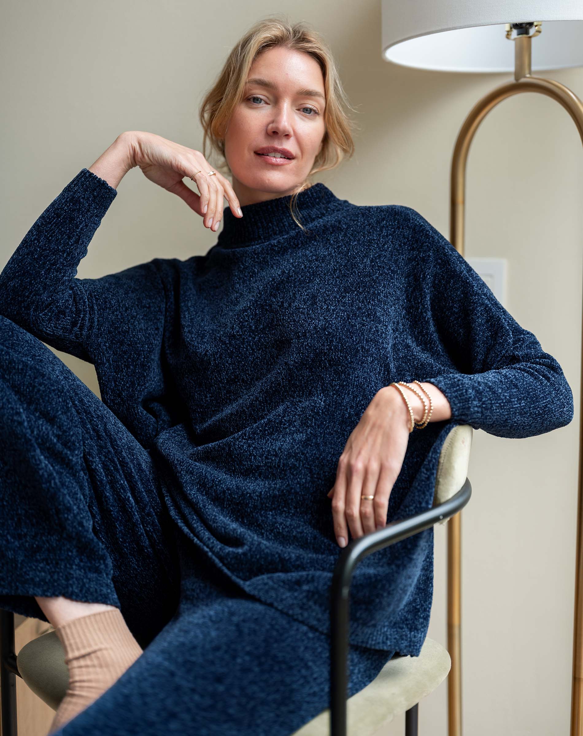 Navy chenille sweater with a high neckline and relaxed fit.