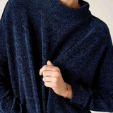 Navy blue mockneck knit top with a soft, textured weave.