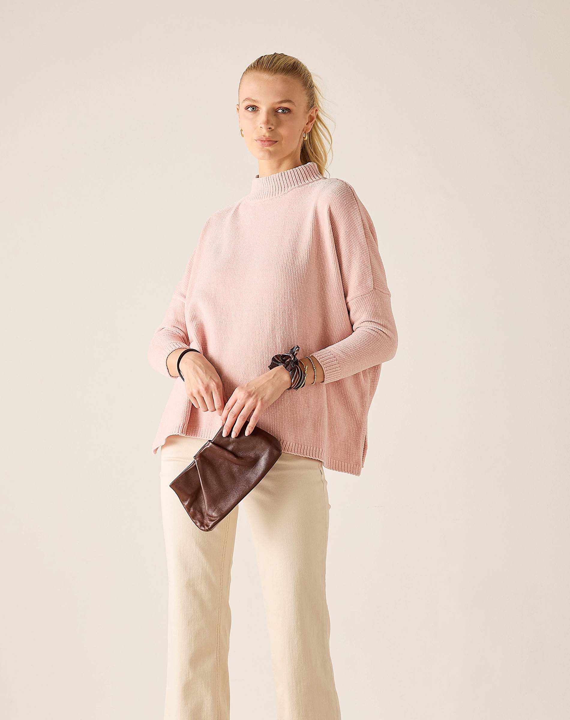 Women's travel-friendly ballet pink mockneck sweater in a soft knit fabric.