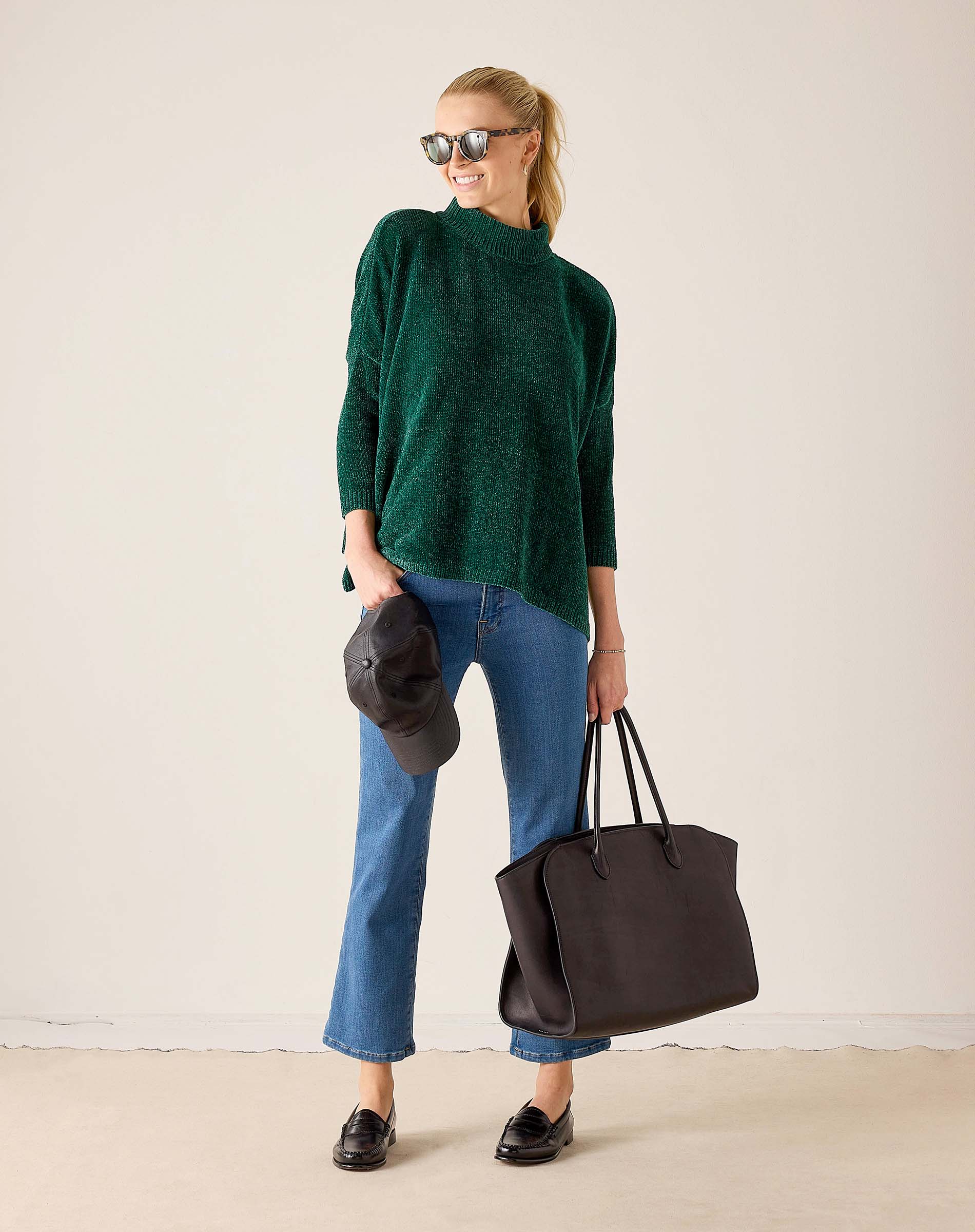 Women's travel-friendly everglade green mockneck sweater in a soft knit fabric.