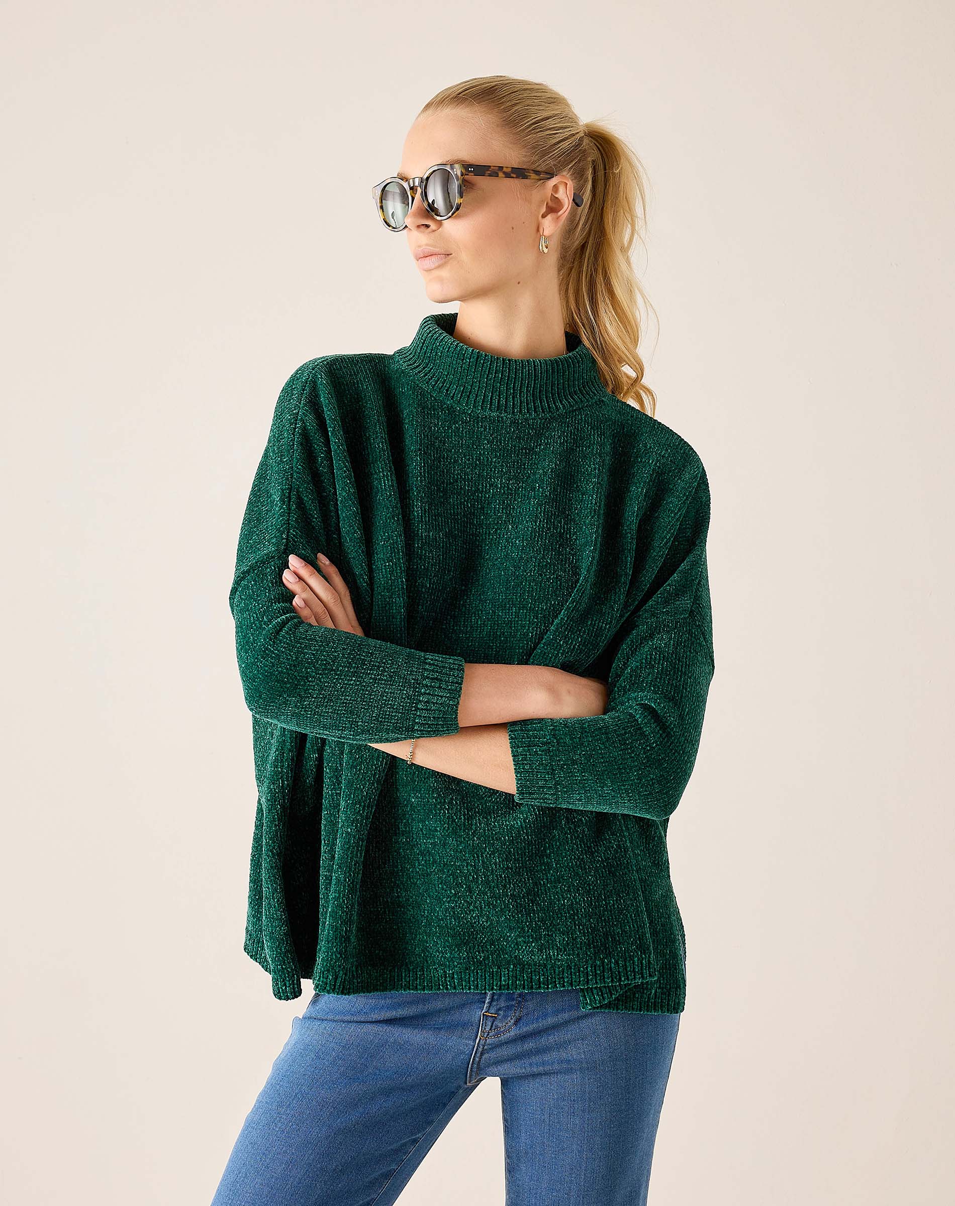 Everglade green mockneck knit sweater with a textured finish.