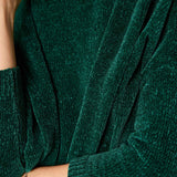 Mockneck sweater in Everglade green with a soft knit texture and ribbed cuffs.