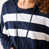 Navy and white striped hoodie worn by a person