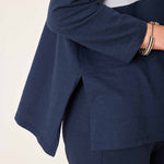 Navy blue outfit with a white background