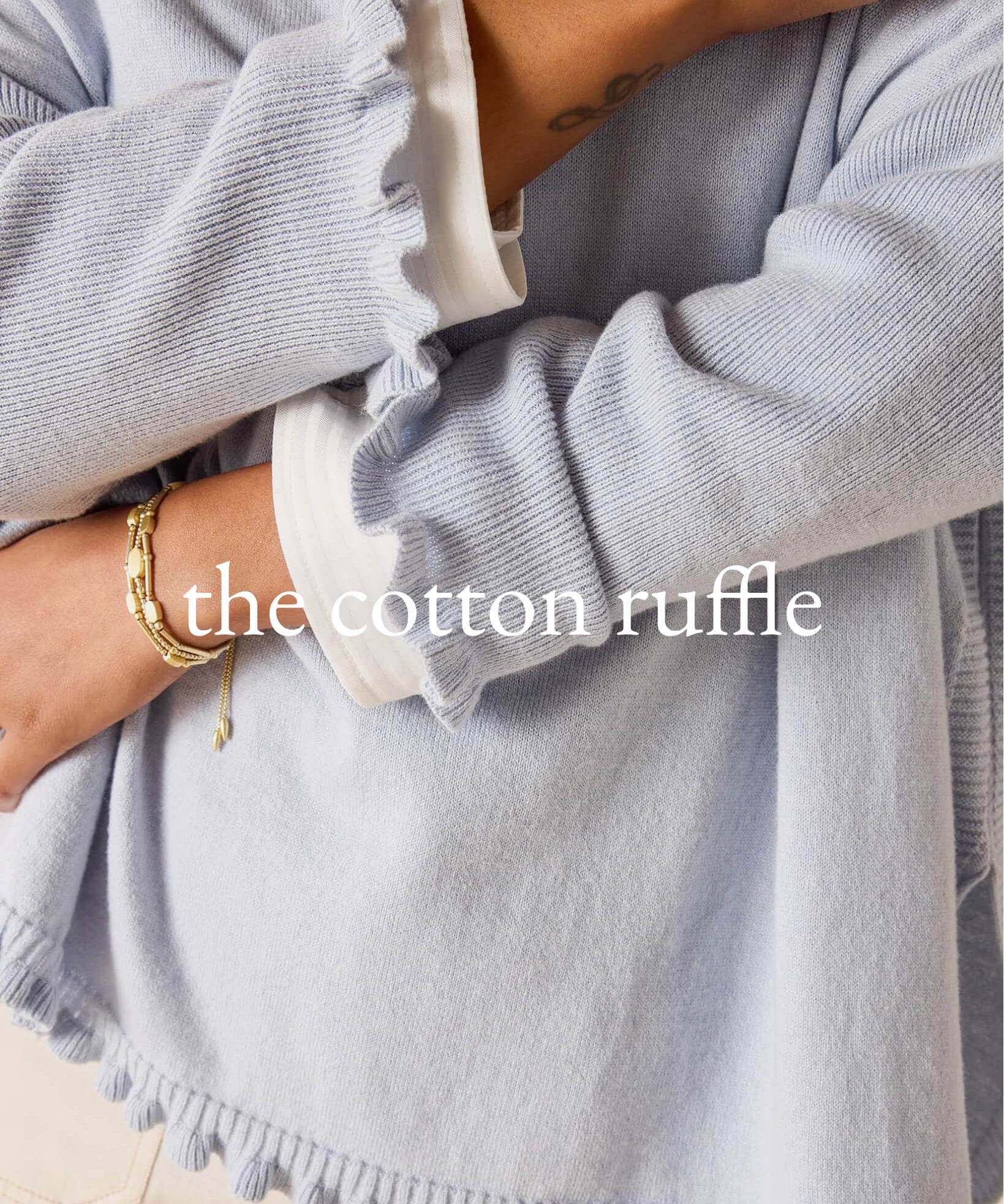 sweater with arms crossed