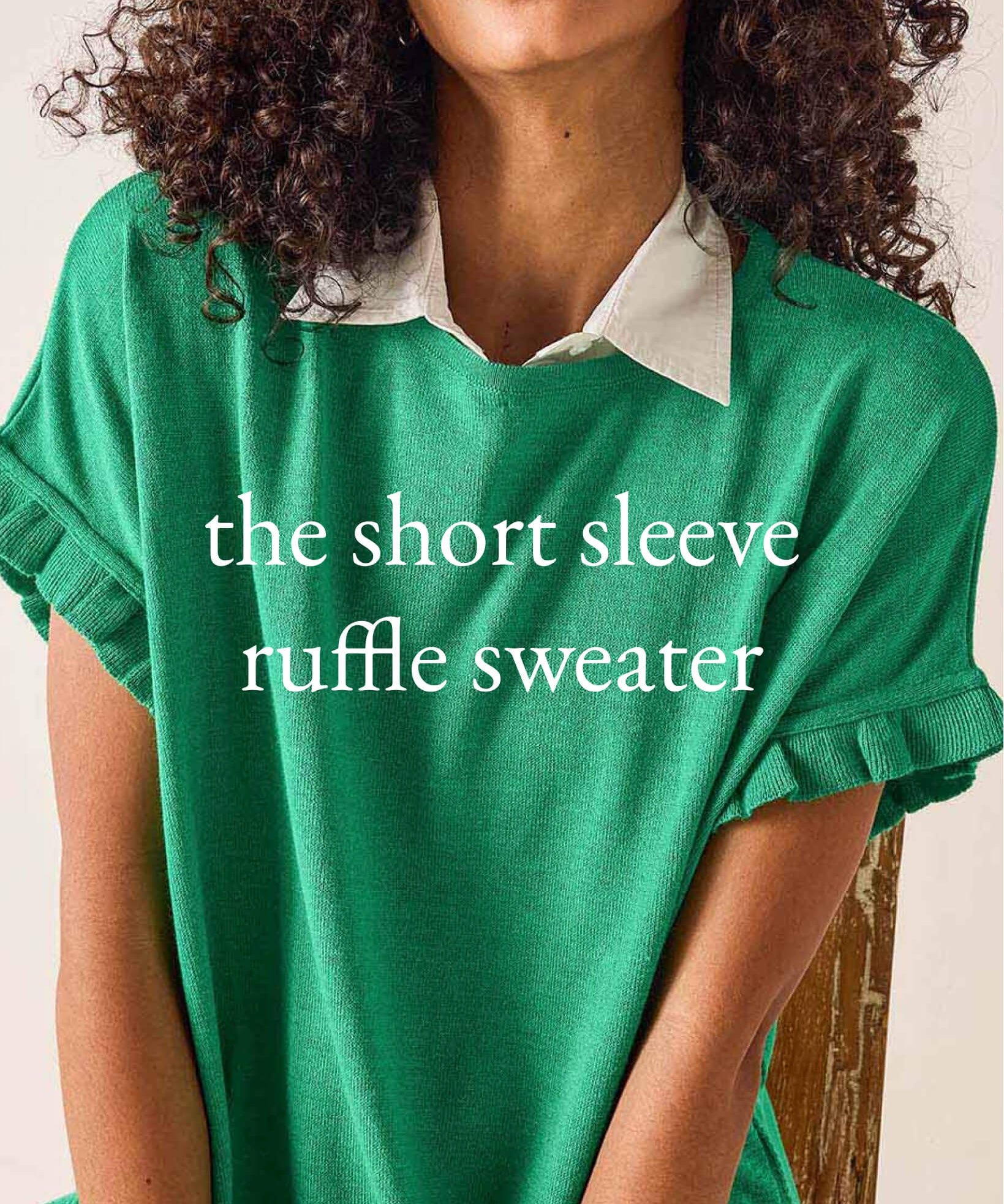 Person wearing a green short-sleeve ruffle sweater with text overlay on a neutral background