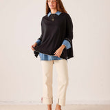 MERSEA ladies' travel-ready black knit Catalina ruffle sweater with a relaxed fit and feminine ruffled hem.
