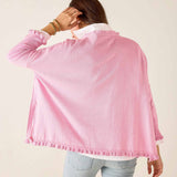 Person wearing a pink jacket with a plain background