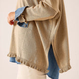 Ladies' travel-ready saddle-colored knit Catalina ruffle sweater with a relaxed fit and distinctive ruffle hem detail.