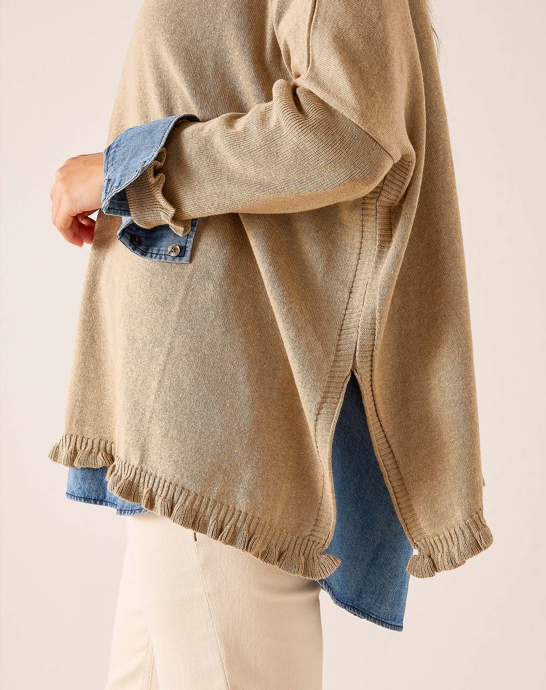 Ladies' travel-ready saddle-colored knit Catalina ruffle sweater with a relaxed fit and distinctive ruffle hem detail.