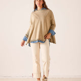 Saddle colored ruffled knit sweater featuring a relaxed fit and a layered look over a button-down shirt.